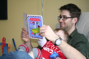 Reading the card that Henry got for daddy.